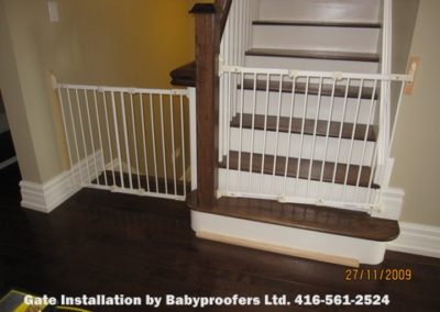 Two typical white baby gates installed side by side.